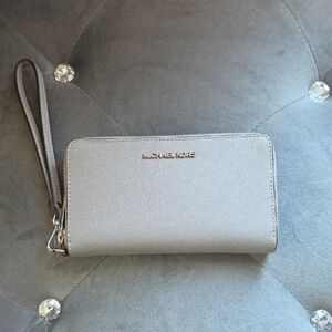 Michael Kors light silver-gray zip wristlet wallet
